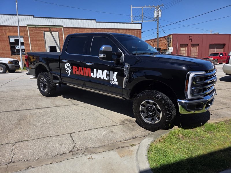 Detailed black Ram Jack work truck with a clean glossy exterior